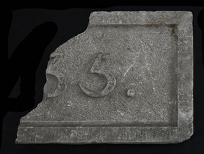 Fragment of facing brick with text ..35, facing brick building part stone, minced meat Rectangular frame and year in high relief
