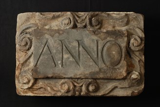 Facade stone with text ANNO in cartouche (at 10494), facing brick foundation stone sculpture sculpture building component