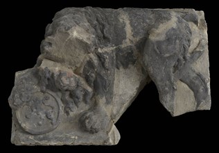 Fragment of facing brick, lion resting on tons, on which lion, facade stone sculpture sculpture building component sandstone