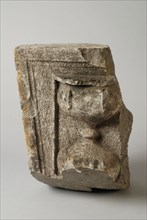 Fragment of facing brick in the form of keystone with hourglass, facing brick fragment sculpture sculpture building part stone