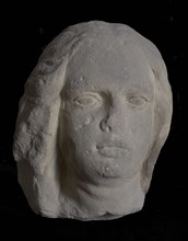 Female head with wavy hair, sculpture sculpture sandstone stone, sculpted Woman's head with wavy hair flattened to the left