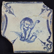 Animal tile, standing elephant frontal on plot between balusters, in blue on white, corner pattern french lily, wall tile