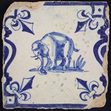 Animal tile, standing elephant to the left on plot between balusters, in blue on white, corner pattern French lily, wall tile