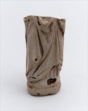 Fragment of pipe and sculpture, bottom with pleated robe, sculpture footage soil finds ceramic pipe earth, in shape pressed