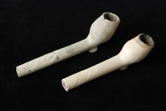 Two clay pipes, double conical head and heel, heel mark and decorated handle, clay pipe smoking equipment smoke floor pottery