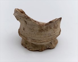 Fragment stoneware mug or bowl on slightly pinched stand ring, cup bowl pot holder can be found on the floor ceramic stoneware