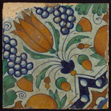 Tile, blue, green, orange and brown on white, star tulip with quarter rosette, bunches of grapes and orange-apples, wall tile