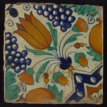 Tile, blue, green, orange and brown on white, star tulip with quarter rosette, bunches of grapes and orange apples, wall tile