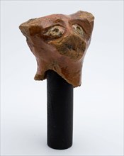 Fragment earthenware animal head, eyes decorated with yellow glaze, sculpture visual material roof tile roofing building