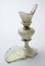 Fragment of part of the foot, trunk and part of the goblet of chalice in clear colorless glass, drinking glass drinking utensils