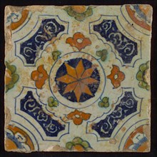Tile, blue, green, brown and orange on white, central an orange star in circle, sgraffito surfaces, corner motif quarter rosette