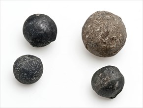 Four lead bullets of different sizes, bullet ammunition soil discovery lead metal largest, cast Four solid metal gray bullets