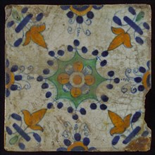 Tile, blue draft, yellow, green and orange on white, central flower within star shape, three-spot around, half rosette, corner
