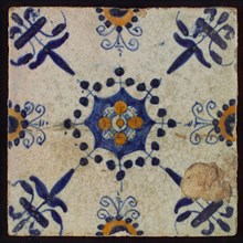 Tile, blue draft and orange on white, centrally flower within star shape, three-piece around, half rosette, corner pattern lily