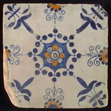 Tile, blue draft and orange on white, central flower within star shape, three-spot around, half rosette, corner motif lily, wall