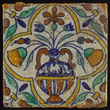 Tile, blue draft, yellow, orange, brown and green on white, centrally flower pot within four-sided frame, corner motif, wall