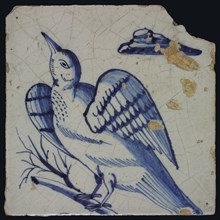 Blue tile with bird looking up at left on barren branch, cloud top right, possible part of pilaster, tile pilaster footage
