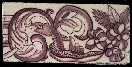 Rectangular edge tile in purple with swirling design of leaves, flowers and twisted snake with scales and fin, border tile wall