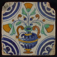 Tile, blue draft, orange, yellow, brown and green on white, central flowerpot with marigolds, corner pattern, rosette, wall tile