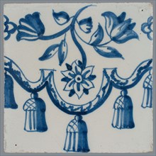 Border tile, blue on white, garland with tassels, above which flower tendril with two tulips and other flower, vertically