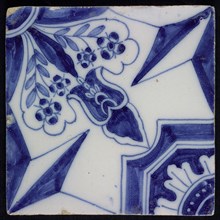 Blue ornament tile, diagonal decor with wide openwork stylized floral motif in one corner with opposite octagonal figure
