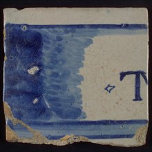 White tile with horizontal surface, partly blue colored, in which letter T, tile picture footage fragment ceramics pottery glaze
