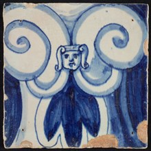 Tile of pilaster, blue on white, part of column with curly ornament with central maskon, tile pilaster footage fragment ceramic