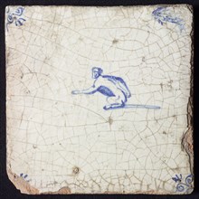 Animal tile, sitting monkey to the left, in blue on white, corner motif ox's head, wall tile tile sculpture ceramic earthenware