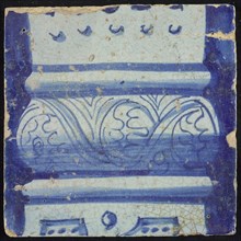 Tile of chimney pilaster, blue on white, bottom of column with basement with curly floral decoration, box with dots, chimney