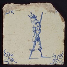Scene tile, child's play, child with stilts, corner motif ox's head, wall tile tile sculpture ceramic earthenware glaze, baked