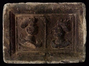 Hearthstone, Luiks, from Luik, Liege Belgium, with wide frame, with male and female head, hearth fireplace part ceramic brick