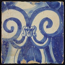Tile of chimney pilaster, blue on white, stylized curly ornament between which maskon, chimney pilaster tile pilaster footage