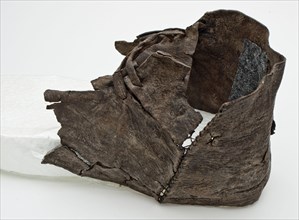 Fragment leather shoe with double leather lacing over the instep, shoe footwear clothing soil find leather, tanned cut sewn