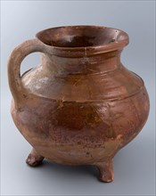 Red brown earthenware cooking jug on three legs, with sausage ear, profile ring on the shoulder, cooking jug kitchenware earth