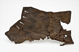 Fragment of low leather shoe, consisting of heel, side with lacing holes, shoe footwear clothing soil finding leather, Rotterdam