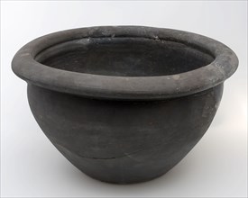 Black storage jar on standing surface, folded top edge above constriction, storage jar pot holder soil found ceramic earthenware