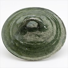 Green casserole lid with curved flat ear in the center of the lid, lid closure part soil find ceramic earthenware glaze lead