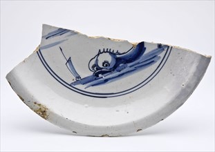 Half faience plate with fish or sea monster in blue on white ground, plate dish crockery holder soil find ceramic earthenware