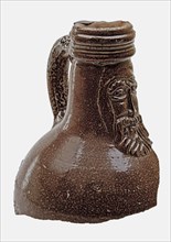 Fragment of bearded jug, brown and gray speckled glazed, Bartmann juggeruik tableware holder soil find ceramic stoneware glaze