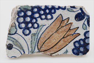 Fragment earthenware tile from quatrefoil with polychrome tulip and bunch of grapes, wall tile tile footage earth discovery