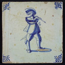 White tile with blue flute-playing warrior with hat; corner pattern ox head, wall tile tile sculpture ceramics pottery glaze