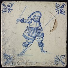 White tile with blue warrior with sword and spear; corner pattern ox head, wall tile tile sculpture ceramic earthenware glaze