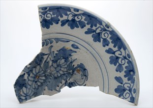 Glued fragment of majolica dish decorated with monochrome decor, blue flowers, dish crockery holder fragment soil find ceramic