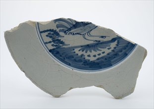 Fragment of faience plate decorated with blue decor, bird, plate crockery holder fragment earthenware pottery earthenware glaze