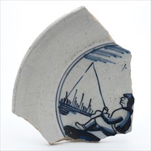 Fragment of faience plate decorated with blue decor, angler, plate crockery holder fragment earthenware ceramics pottery glaze