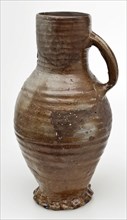 Stoneware jug, with ear, on pinched foot ring, brown and gray salt glaze, jug be found in the earth ceramic stoneware glaze salt