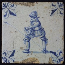 White tile with blue warrior; corner pattern lily, wall tile tile sculpture ceramic earthenware glaze, baked 2x glazed painted