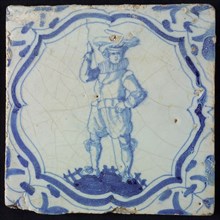 White tile with blue warrior in accolade-shaped frame; corner motif wing leaf, wall tile tile sculpture ceramic earthenware