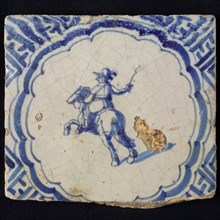 White tile with blue horseman, scalloped frame with meander, wall tile tile sculpture ceramic earthenware glaze, baked 2x glazed
