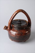 Brown kettle on three legs with fixed handle, lid rim and round spout, kettle soil found ceramic earthenware glaze lead glaze